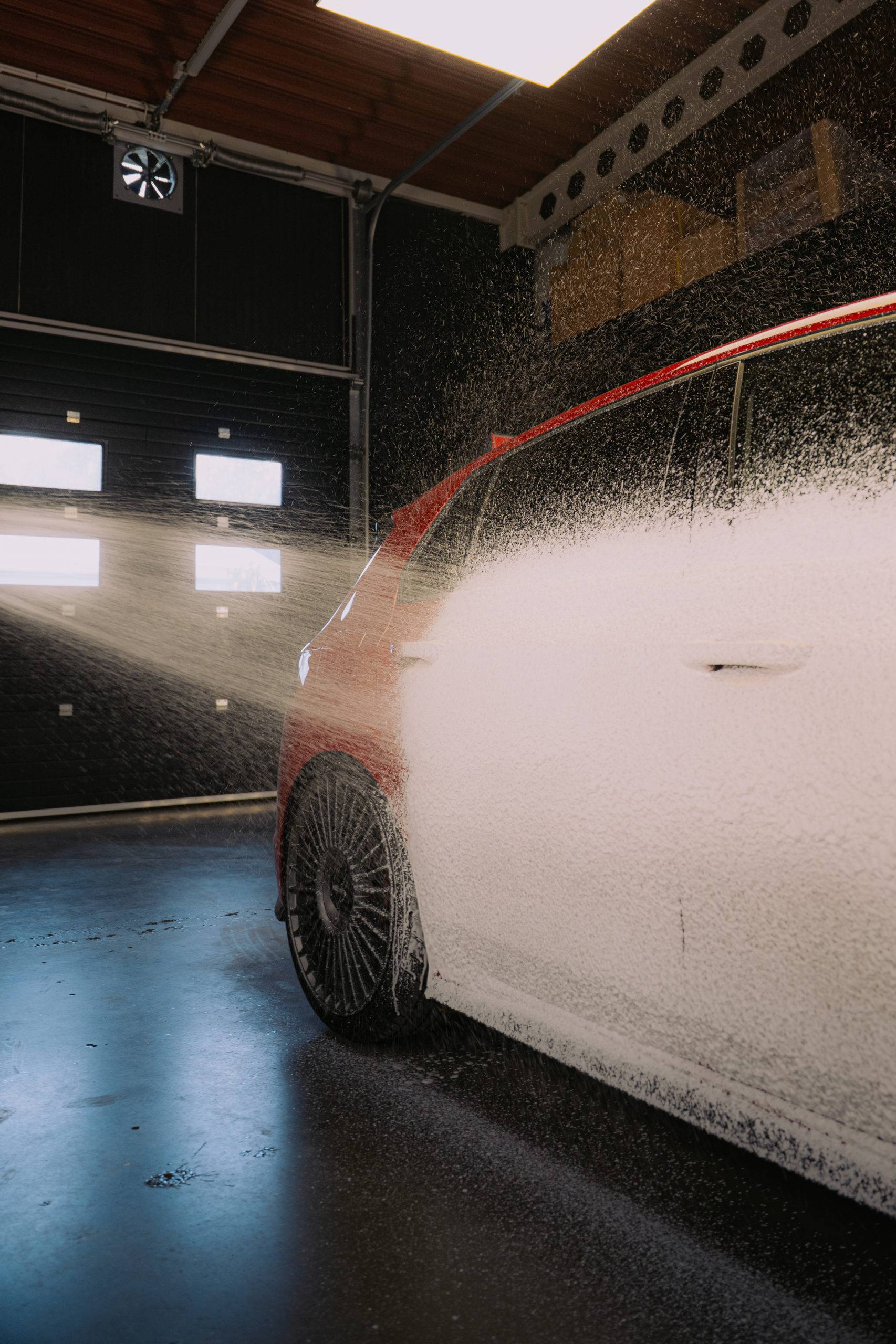 Work Stuff Snow Foam Gun applying foam to a car