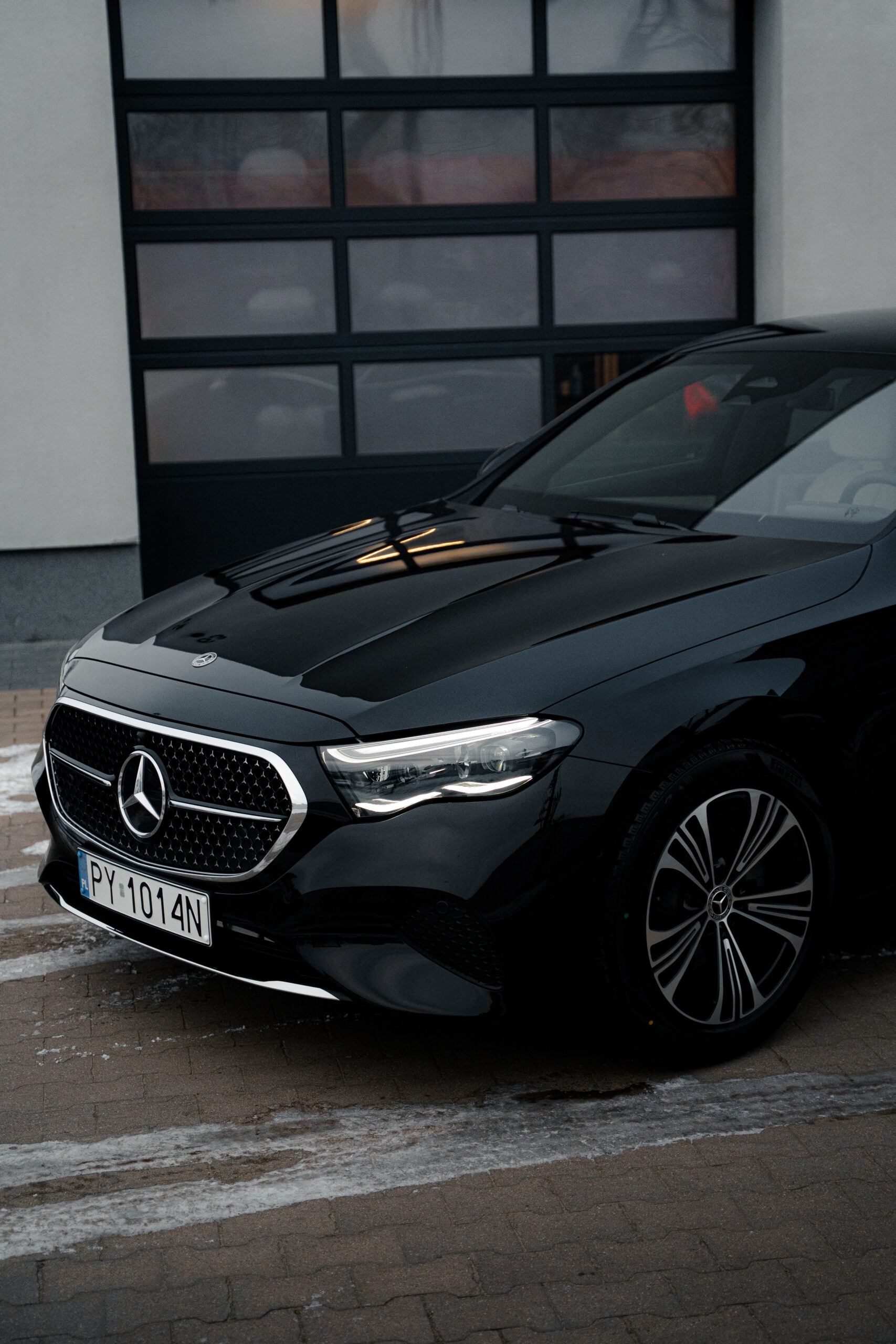 Glossy black car finish after graphene ceramic coating application